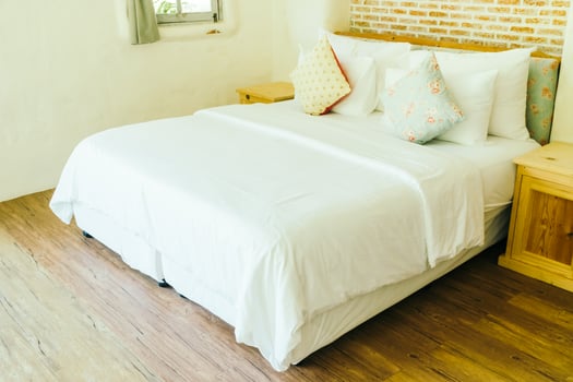Pillow on bed decoration in bedroom interior photo