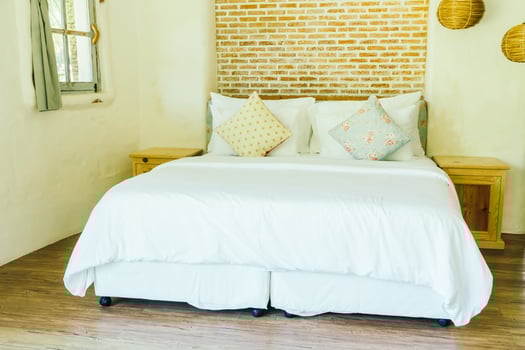 Pillow on bed decoration in bedroom interior photo