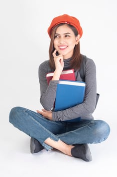 Beautiful university woman on white background photo