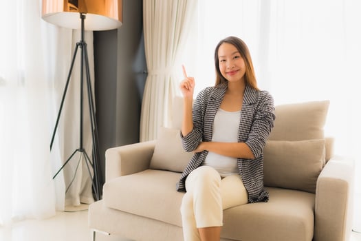 Portrait beautiful young asian women happy smile relax sitting on sofa chair photo