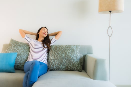 Portrait beautiful young asian woman smile happy on sofa photo