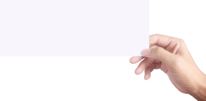 Empty space for text.Hand is holding the white blank paper photo