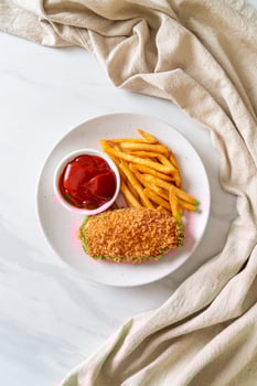 Fried chicken breast fillet steak with French fries and ketchup photo