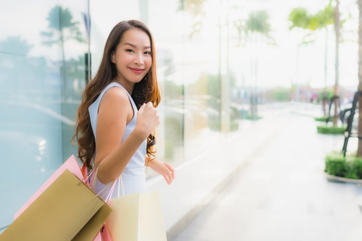 Portrait beautiful young asian woman happy and smile with shopping bag from department store photo