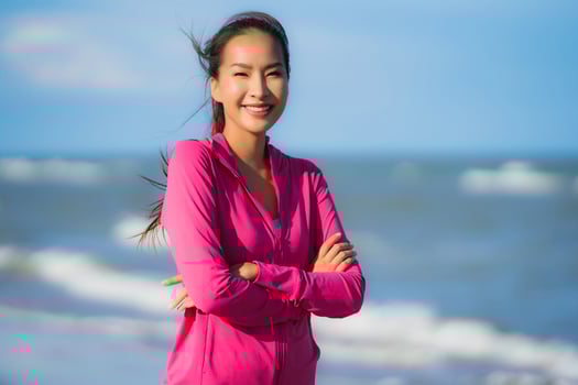 Portrait beautiful young asian woman running and exercising on the tropical outdoor nature beach sea ocean photo