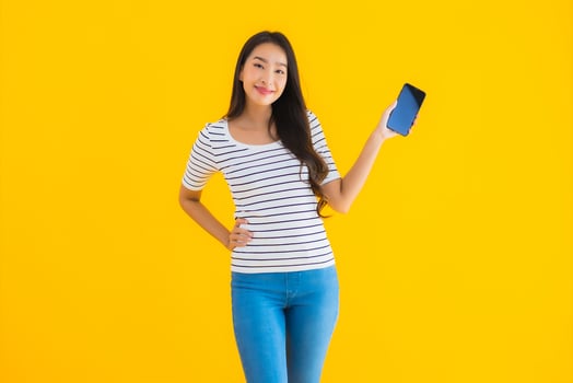Portrait beautiful young asian woman smile happy use smart mobile phone photo