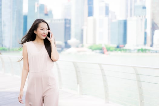 Asian woman using smartphone or mobile phone for talking or text photo