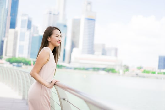 Beautiful asian woman smile and happy to travel in singapore city photo
