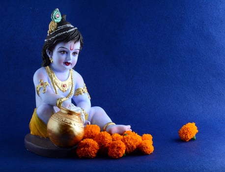 Hindu God Krishna on blue background photo