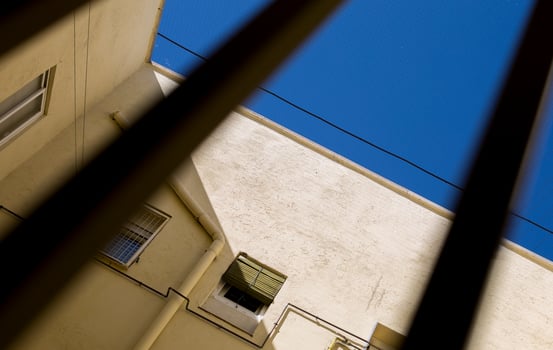 Mesh placement to prevent the birds from going down in the patios of the houses in Madrid, Spain photo