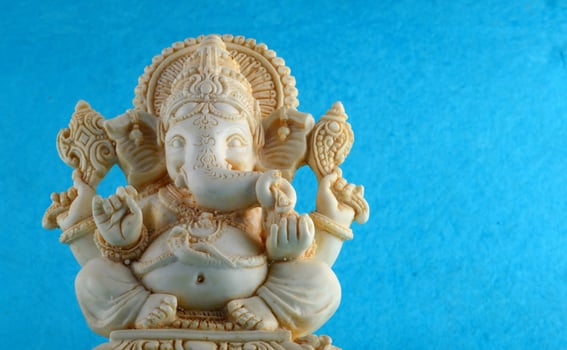 Hindu God Ganesha. Ganesha Idol on blue background photo