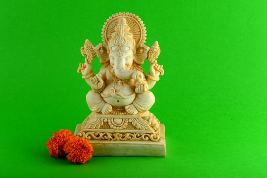 Hindu God Ganesha. Ganesha Idol on green background photo
