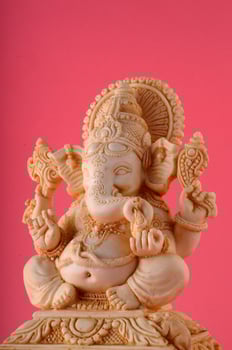 Hindu God Ganesha. Ganesha Idol on pink background photo