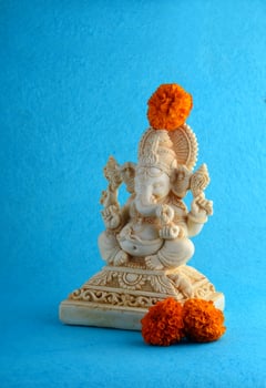 Hindu God Ganesha. Ganesha Idol on blue background photo