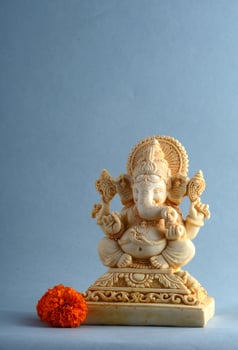 Hindu God Ganesha. Ganesha Idol on gray background photo