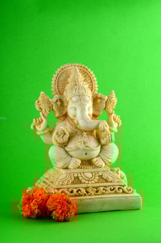 Hindu God Ganesha. Ganesha Idol on green background photo