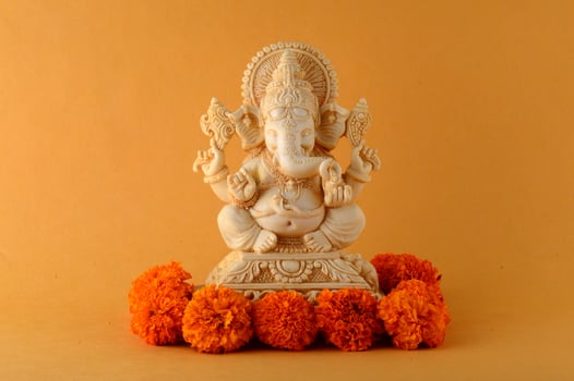 Hindu God Ganesha. Ganesha Idol on yellow background photo