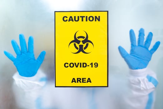 Picture of a doctor via window of quarantine unit in the hospital asking for help of protection and support. coronavirus, covid-19, and medical concept photo