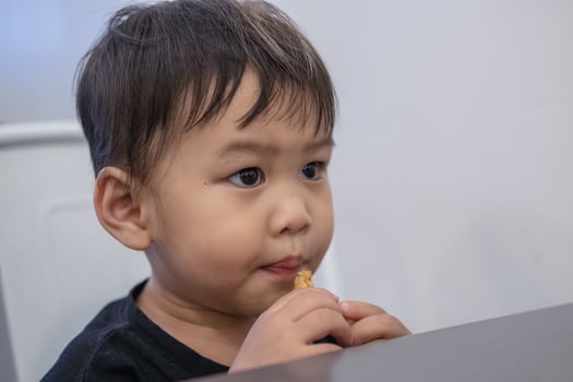 Children are sitting to eat French fries at restaurants. photo
