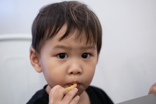 Children are sitting to eat French fries at restaurants. photo