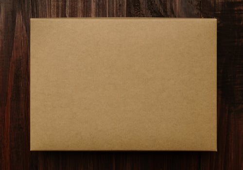 Cardboard box mockup on wooden background photo