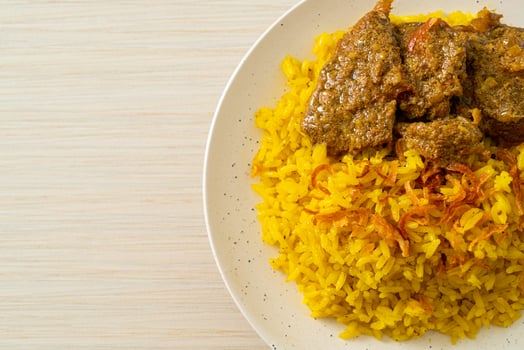 Beef Biryani or Curried rice and beef - Thai-Muslim version of Indian biryani, with fragrant yellow rice and beef photo