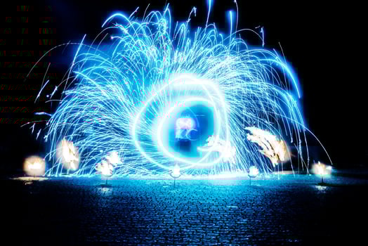 fiery pieces of a fire show photo