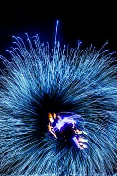 fiery pieces of a fire show photo