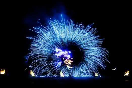 fiery pieces of a fire show photo