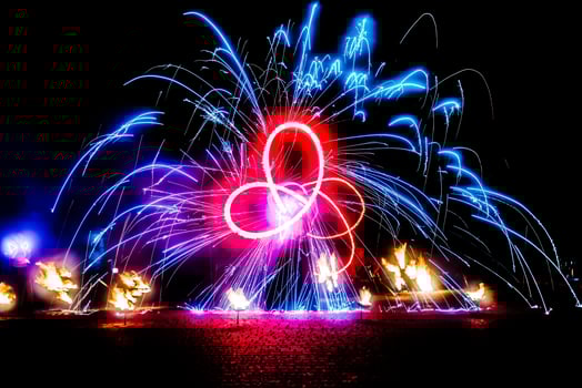 fiery pieces of a fire show photo