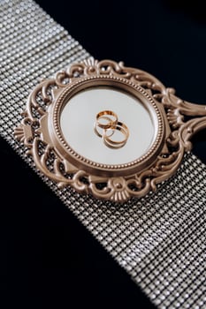 wedding rings with a wedding decor photo