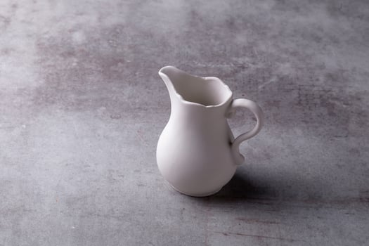 Teapot creamer, Cup and saucer on Cement Board photo