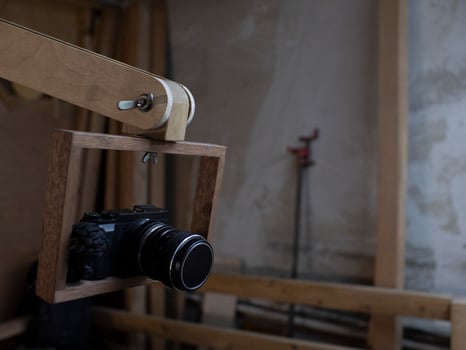PHOTO CAMERA IN A WOODEN FRAME