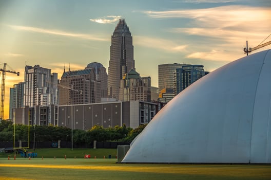 early morning sunrise over charlotte north carolina and new carolina panthers training facility dome photo