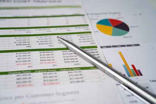 Spreadsheet table paper with pen. Finance development, Banking Account, Statistics Investment Analytic research data economy, trading, Mobile office reporting Business company meeting concept. photo