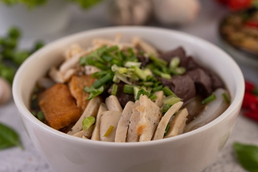 Large noodle noodles with pork blood sausage photo