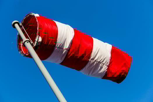 Windsock in the blue sky photo