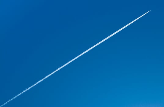 Airplane flying in the blue sky photo