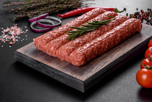 Fresh raw mince for grilled kebab with spices and herbs photo