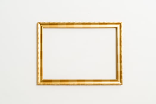 Empty picture frame on white wall background with copy space photo