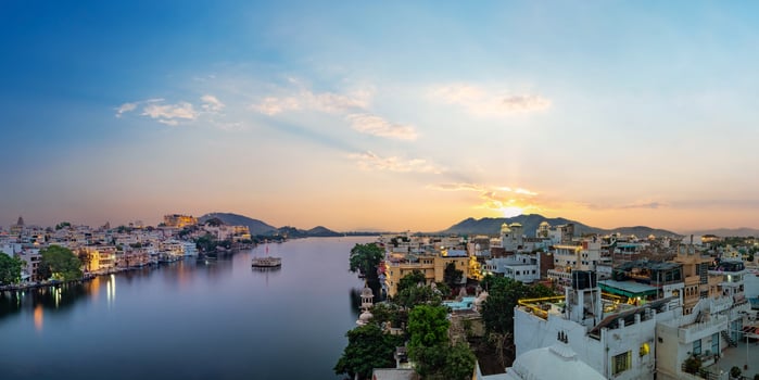 Udaipur city at lake Pichola in the evening photo