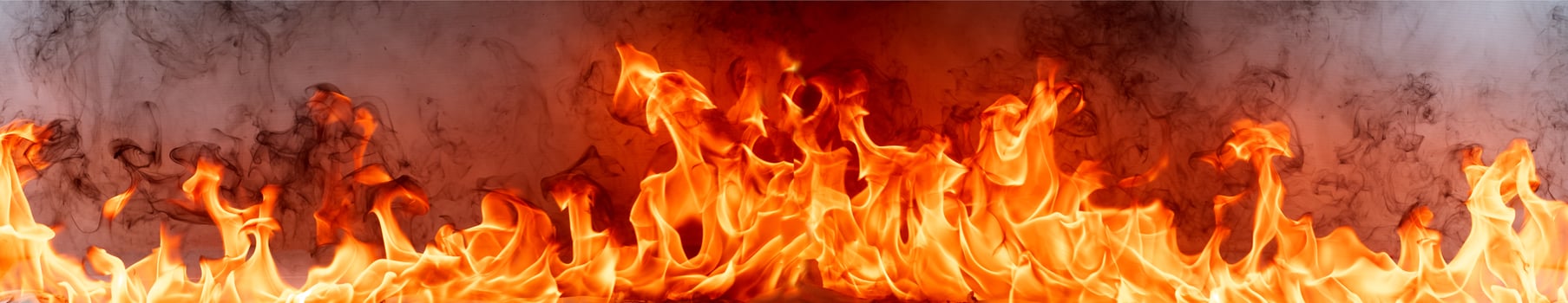 Fire flames with smoke on black background photo