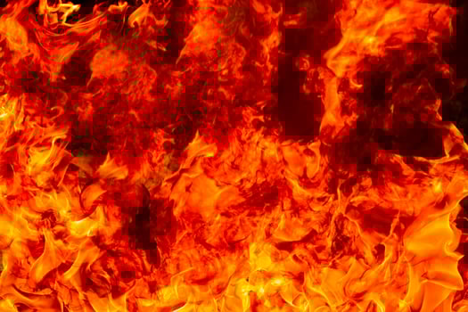 Fire flames with smoke on black background photo
