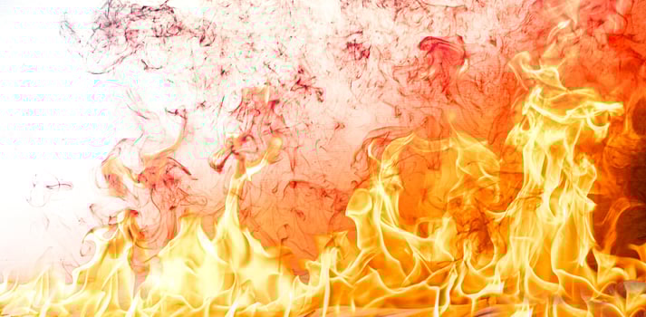 Fire flames with smoke on black background photo