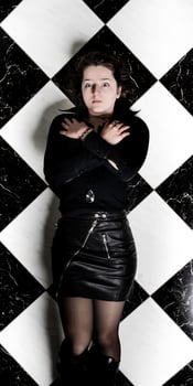A young girl in leather clothes photo