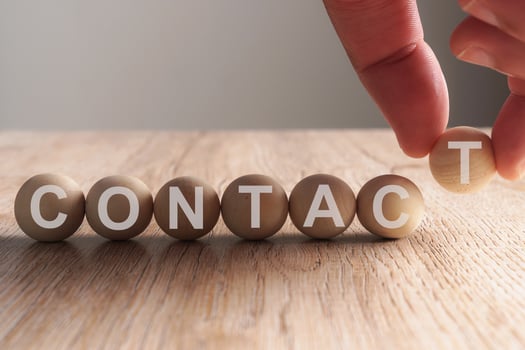 Hand putting on work word written in wooden ball photo