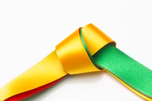 Coloured fabrics and ribbons, basic colours on a white background photo