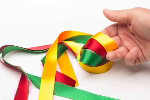 hand with coloured ribbon photo