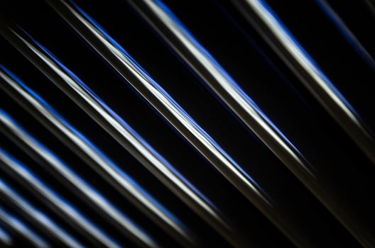 abstract dark black background with shiny metallic lines photo