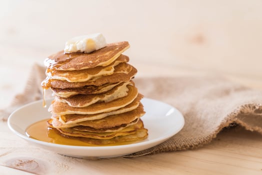 Cheese on pancake stack with honey photo